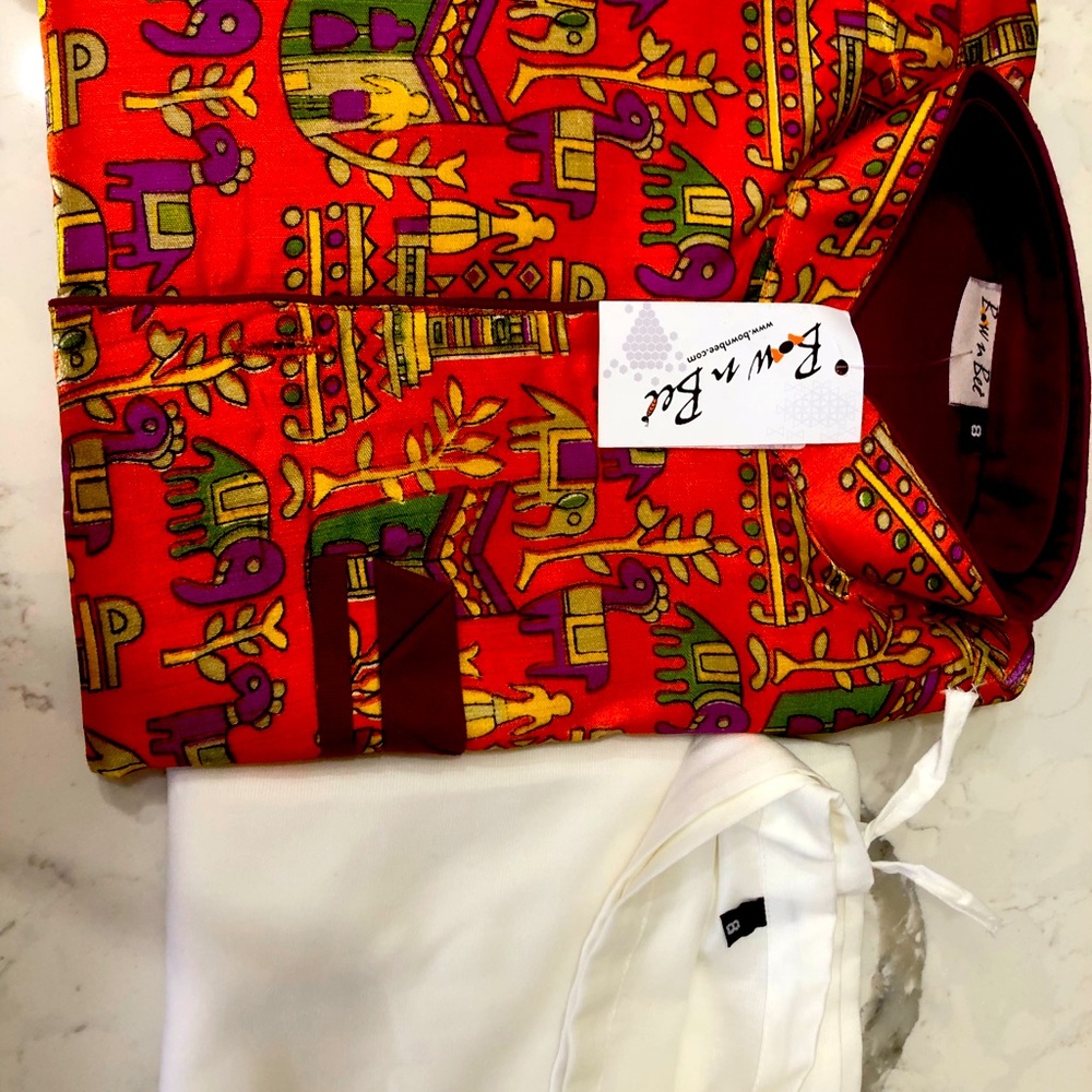 Kurta pajama with village art waist coat.